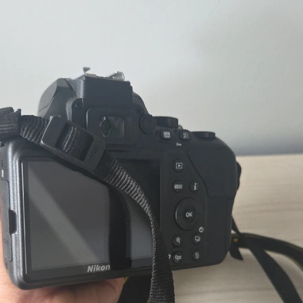 Nikon Black Camera D3500 with Zoom Lens and Black/Yellow Strap/ Charger Included